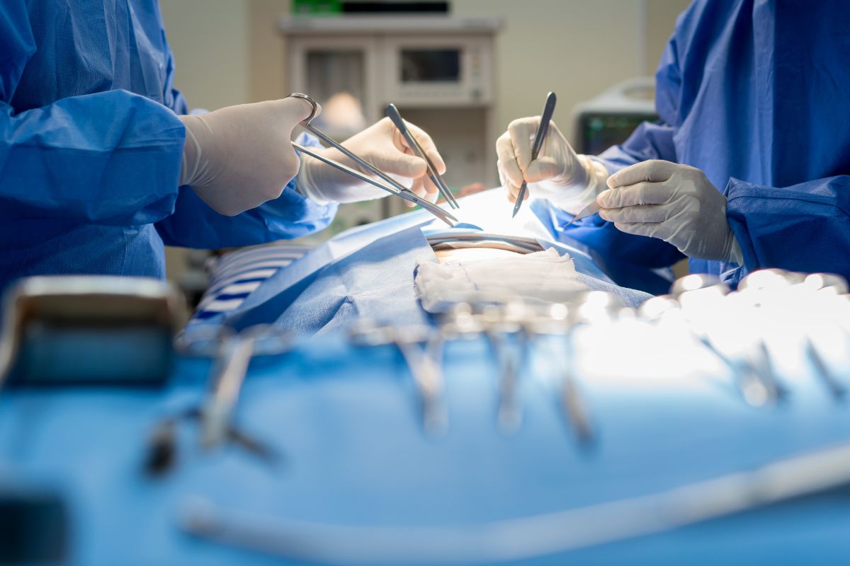 View from the front of the hands of two doctors operating